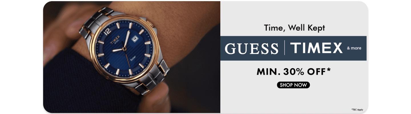 Minimum thirty percent off on Timex and Guess watches featuring a blue dial solar watch on a wrist. Shop the sale now.