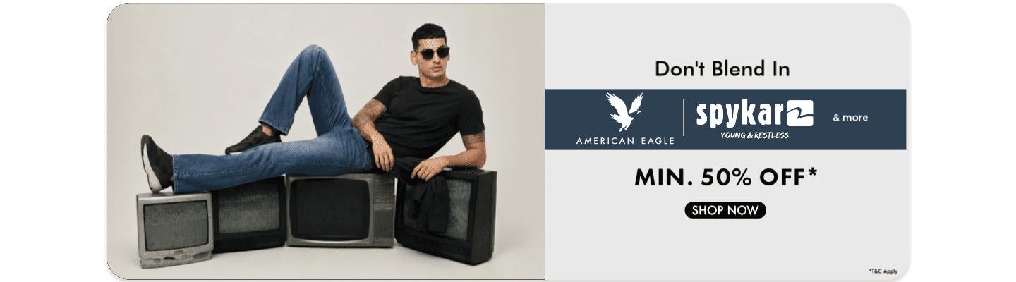 Minimum fifty percent off on American Eagle and Spykar clothing featuring a man in a black t shirt and blue denim jeans.